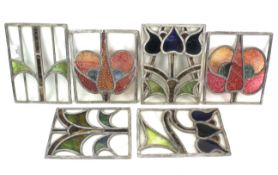 Six panels of leaded stained glass.