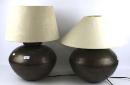 Two contemporary hammered metal table lamps.