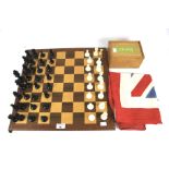 A Chad Valley chess set and two Union Jack flags.