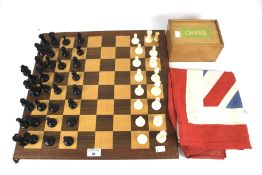 A Chad Valley chess set and two Union Jack flags.