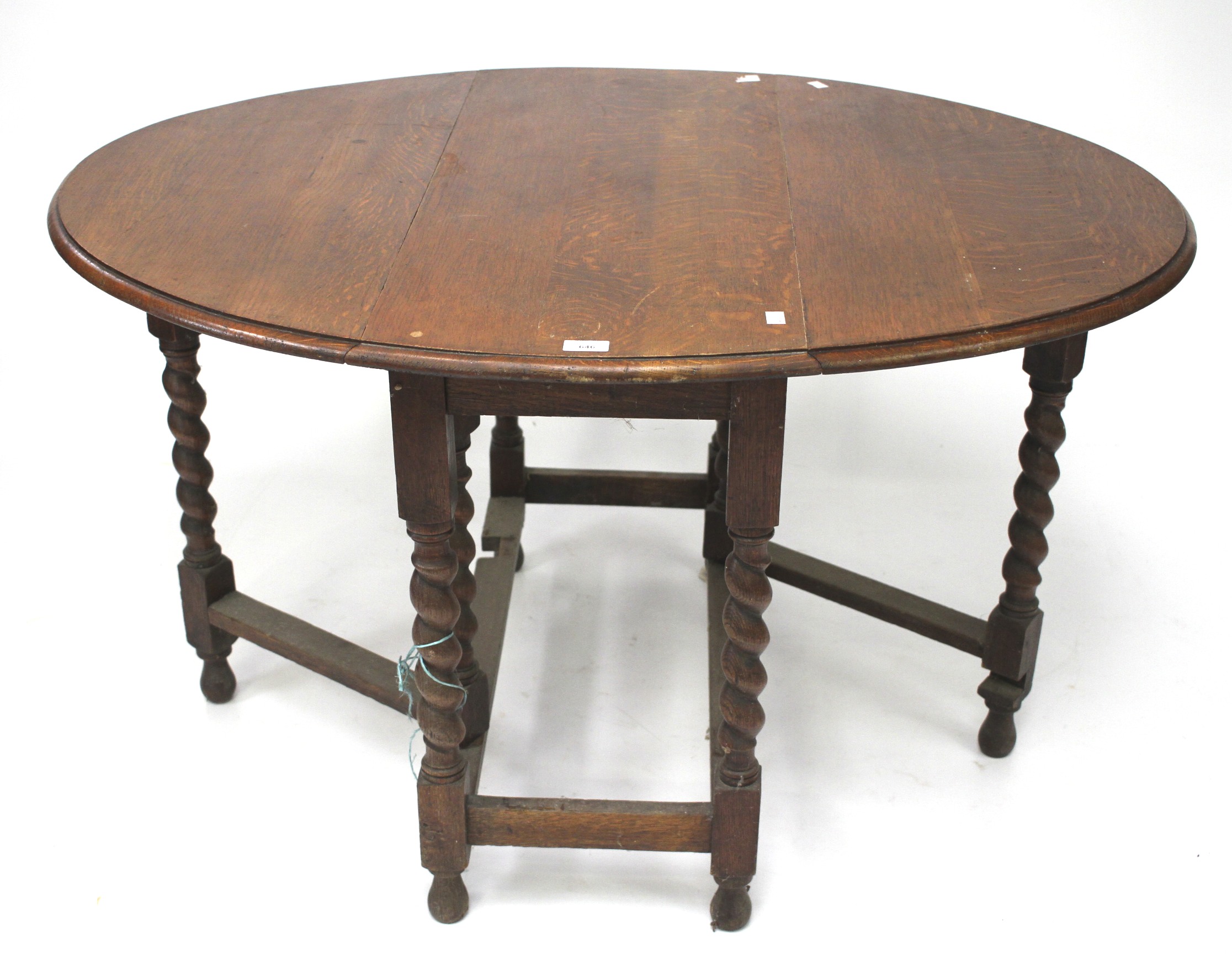 A 1930s oak oval toped gateleg table. - Image 2 of 2