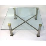 A contemporary glass topped coffee table.