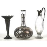 A small 19th century silver mounted glass pouring vessel and other items.
