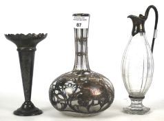 A small 19th century silver mounted glass pouring vessel and other items.