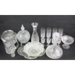 An assortment of cut and moulded glassware.