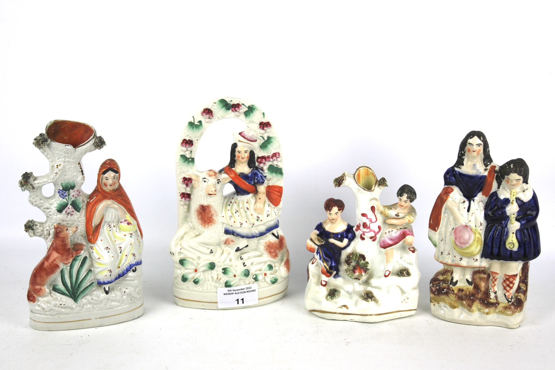 Four 19th century Staffordshire pottery figures.