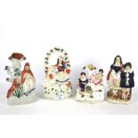Four 19th century Staffordshire pottery figures.