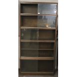 A mid-century multi-section bookcase by Minty 'library specialists'.