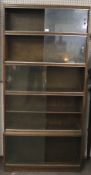 A mid-century multi-section bookcase by Minty 'library specialists'.