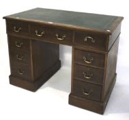 A late 19th/early 20th century mahogany twin pedestal desk by James Shoolbred & Co.