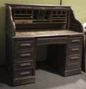 An early 20th century roll top oak desk.