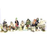 A collection of assorted Staffordshire pottery figures.