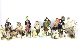 A collection of assorted Staffordshire pottery figures.