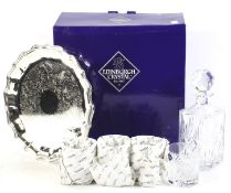 A boxed Edinburgh Crystal table set. In the 'Embassy' pattern, including a tray, decanters, etc.