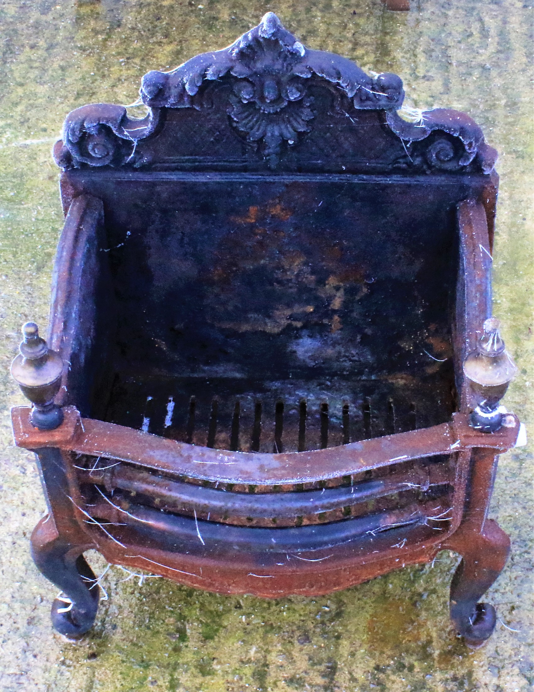 A cast iron fire grate.