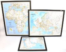 Three large contemporary framed maps.