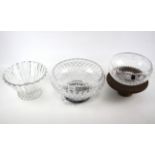 Three large cut glass bowls.