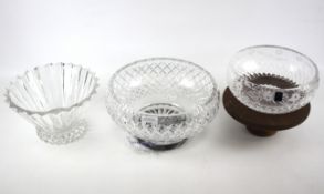 Three large cut glass bowls.