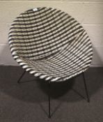 A mid-20th century wicker chair.
