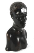 An ebonised native African carved bust of a lady.
