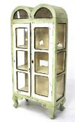 An early 20th century white painted glazed display cabinet.