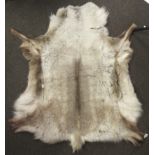 A natural goatskin rug.