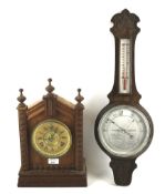 A contemporary mantel clock and a 19th century banjo barometer.