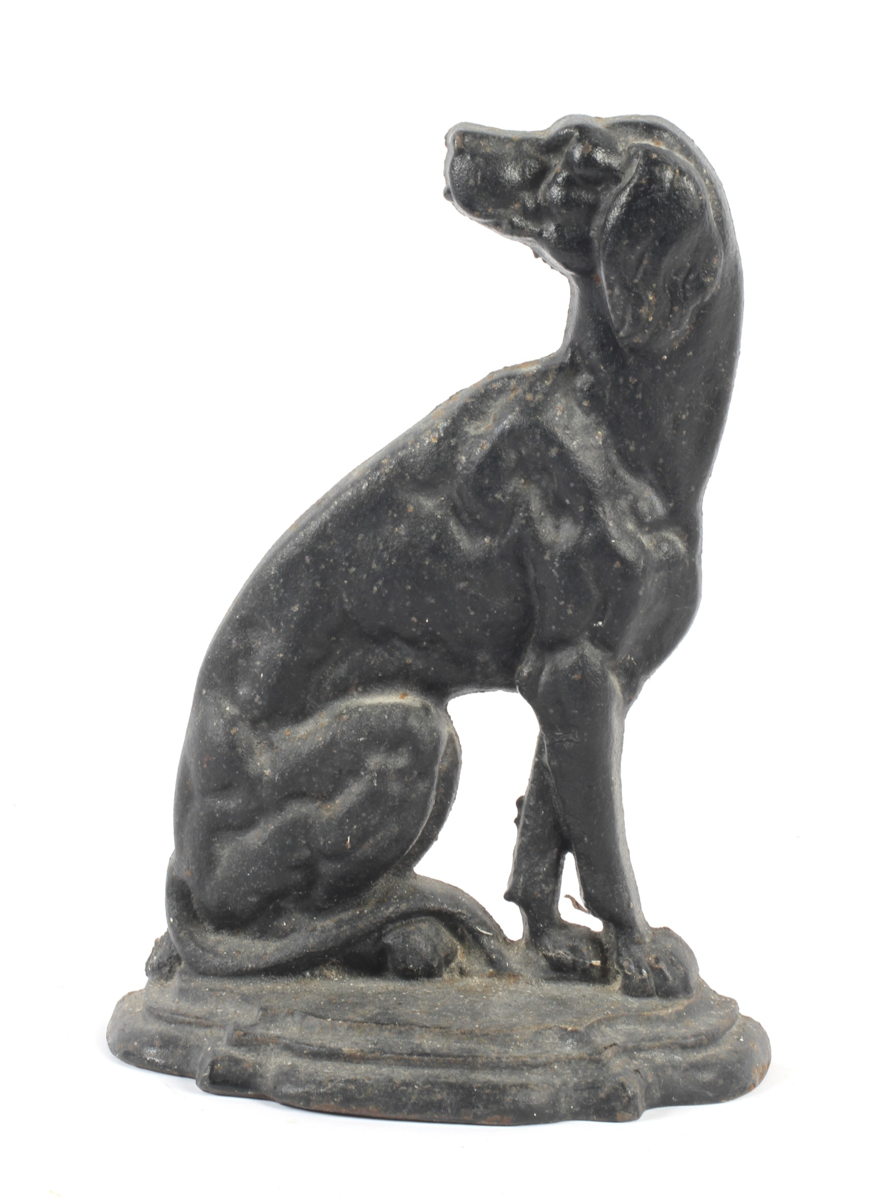 A cast iron doorstop in the form of a seated hound.