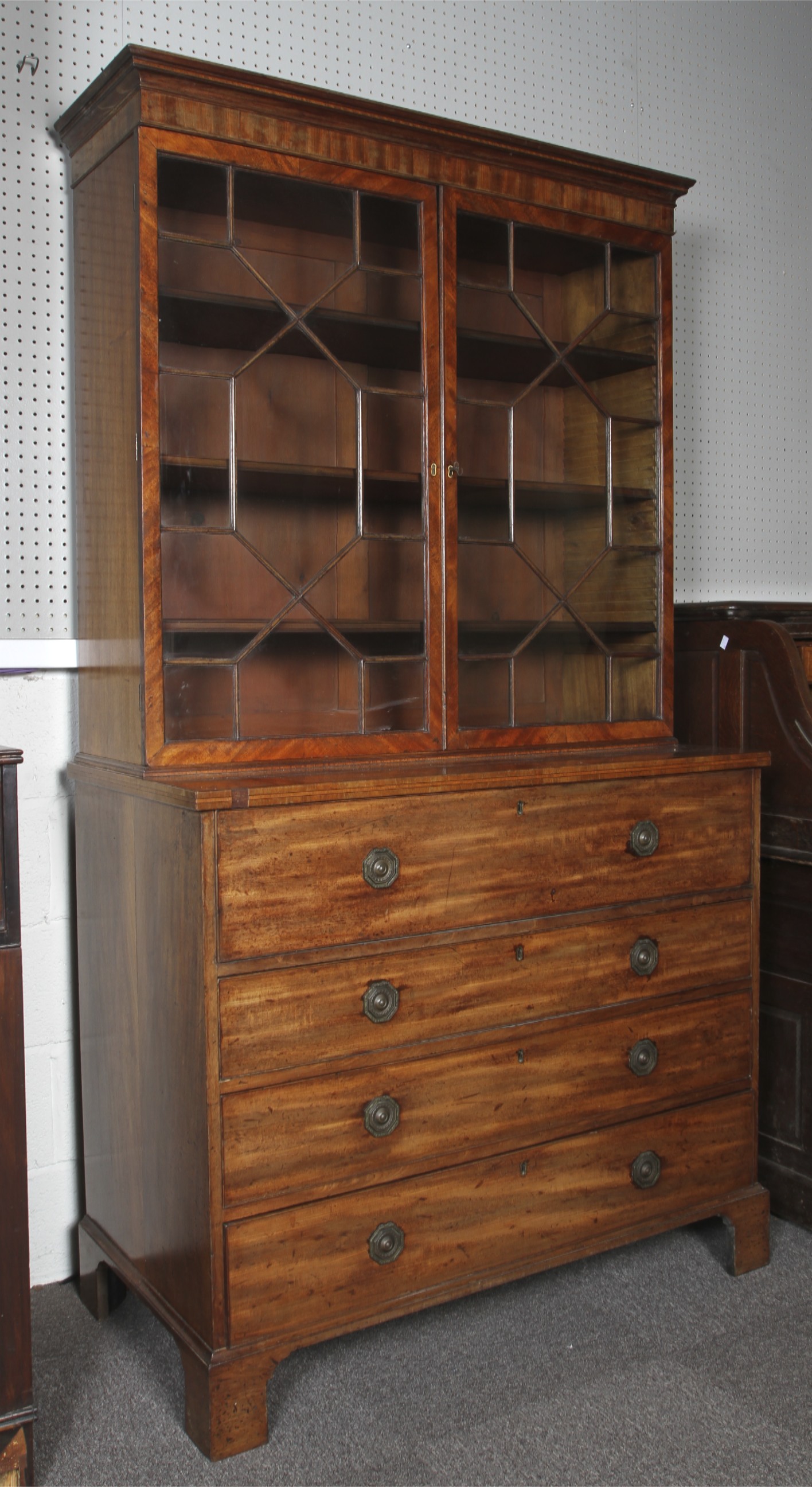A George III inlaid mahogany secretaire bookcase.