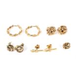 Four pairs of vintage gold stud earrings.