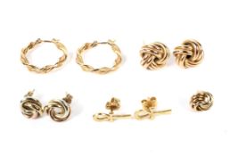 Four pairs of vintage gold stud earrings.