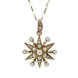 A vintage gold and imitation-half-pearl 'starburst' pendant in Victorian style, and a chain.
