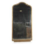 An early 20th century large giltwood arched rectangular wall mirror.