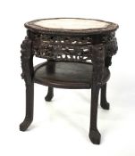 A fine Chinese carved wooden marble topped occasional table with undertier.