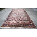 A large early 20th century room size persian carpet.