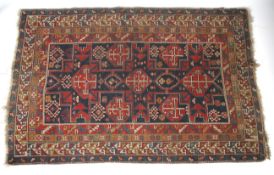 A Caucasian wool rug.