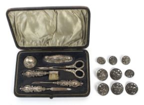A six piece silver cased ladies manicure set and a set of buttons.