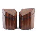 A pair of George III mahogany knife boxes of serpentine form.