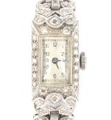 An early 20th century lady's white gold and diamond cocktail watch, circa 1935.