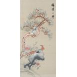 A 20th century Chinese silk needlework picture of two pheasants perched amongst flowering trees.