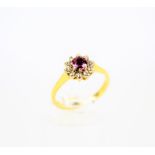 A vintage 18ct gold, ruby and diamond cluster ring.