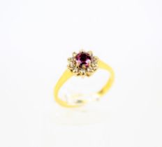 A vintage 18ct gold, ruby and diamond cluster ring.