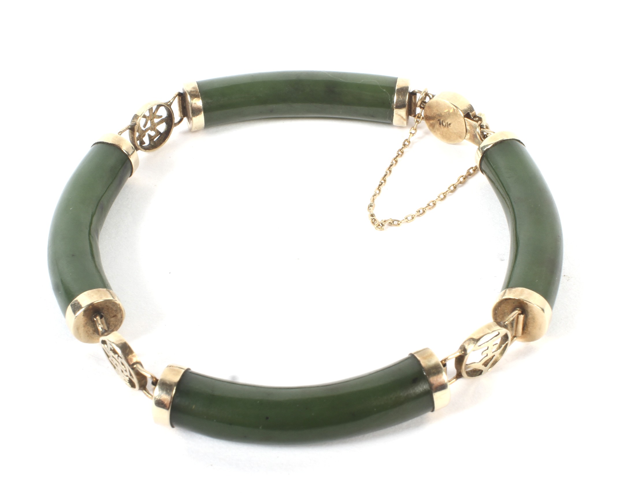 A Far Eastern yellow metal nephrite bracelet.