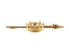 An early 20th century gold 'Naval crown' badge bar brooch. Stamped '9ct', 50mm long overall, 3.3g.