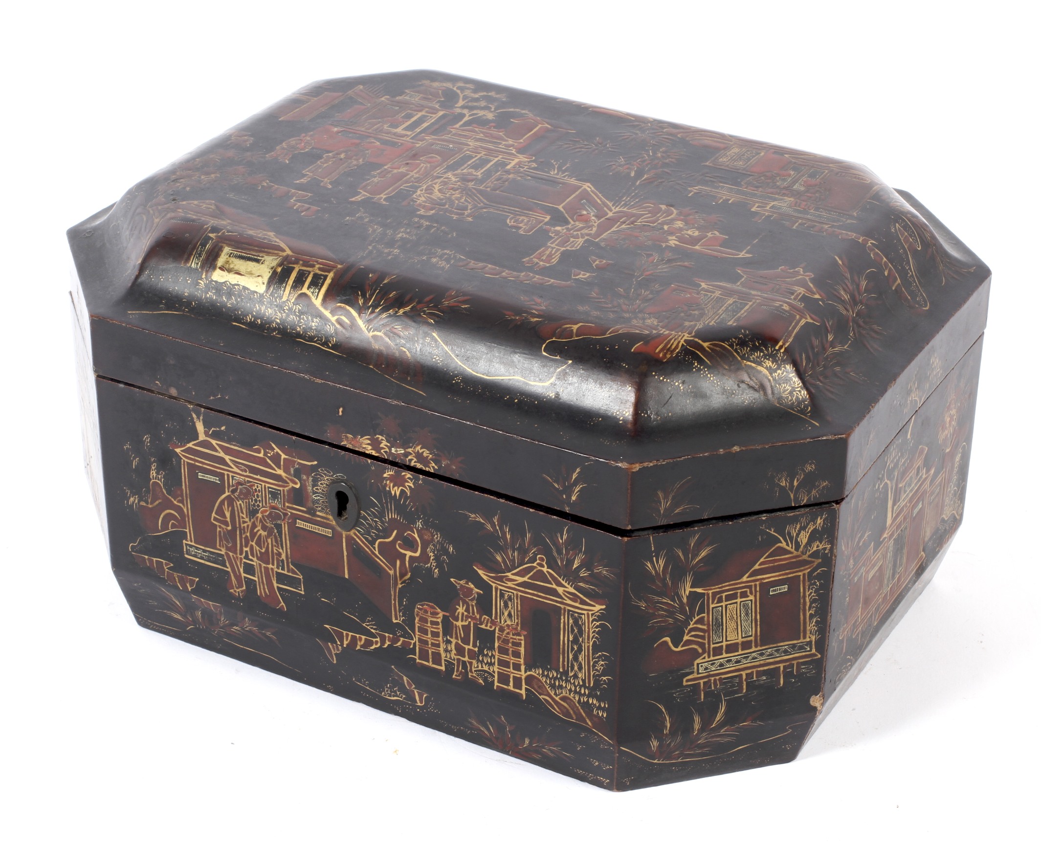 A Lacquered elongated octanganal wooden Chinoiserie decorated tea caddy.