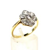 A vintage 18ct gold and diamond flower-head cluster ring. The seven round brilliants approx. 1.