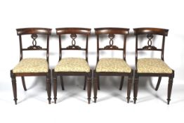 A set of four 19th century rosewood dining chairs.