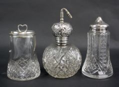 Three silver topped glass shakers. Including an atomiser.