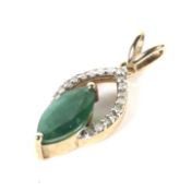 A modern emerald and diamond open elliptical pendant.