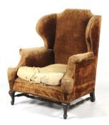 A 19th century wing back elbow chair.